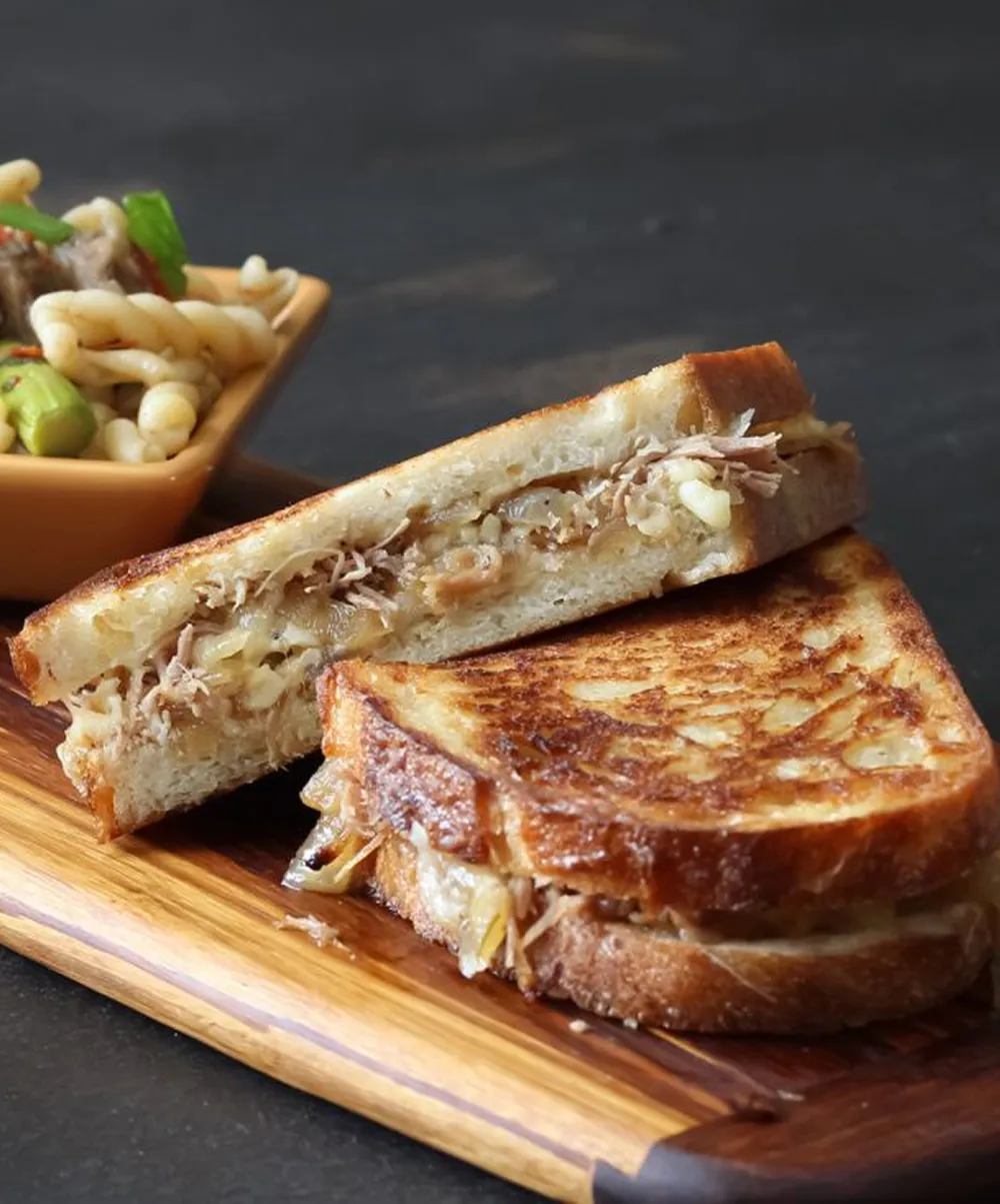 Duck confit grilled cheese sandwich with melted cheese
