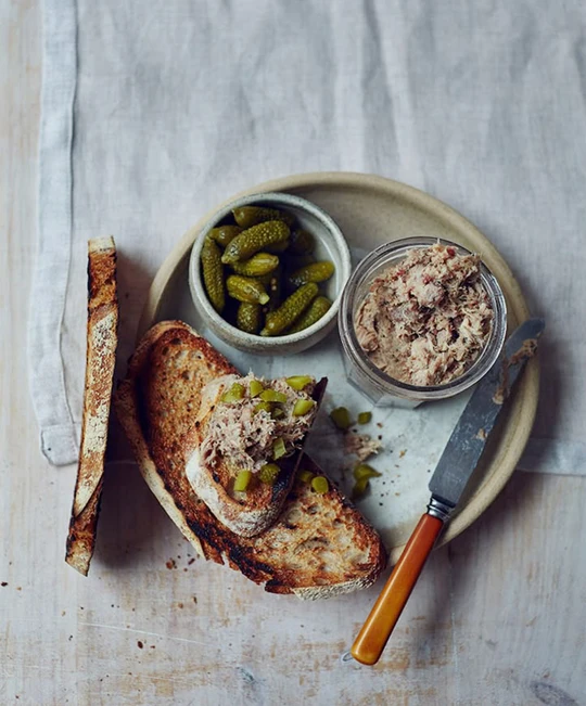 Tartines of duck rillettes with sliced gherkins