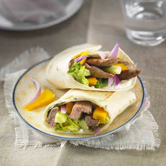 Fresh duck confit wraps with mango and herbs